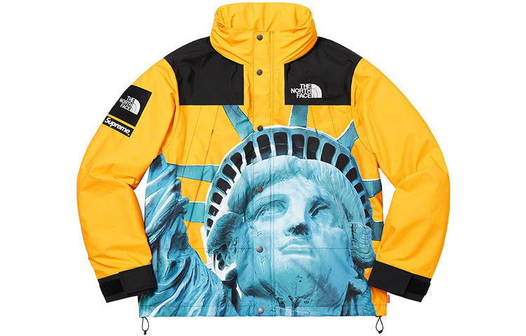 جاكيت تبادل مقاوم للماء بتصميم تمثال الحرية من Supreme x The North Face للجنسين باللون الأصفر SUP-FW19-907