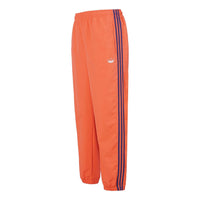 adidas originals Woven Three Stripe Warm up Pants DV3141