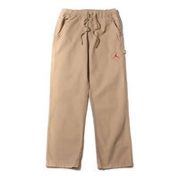 بنطال قماشي من Air Jordan x Cactus Jack من Travis Scott، لون Desert Khaki University Red، DD4778-201